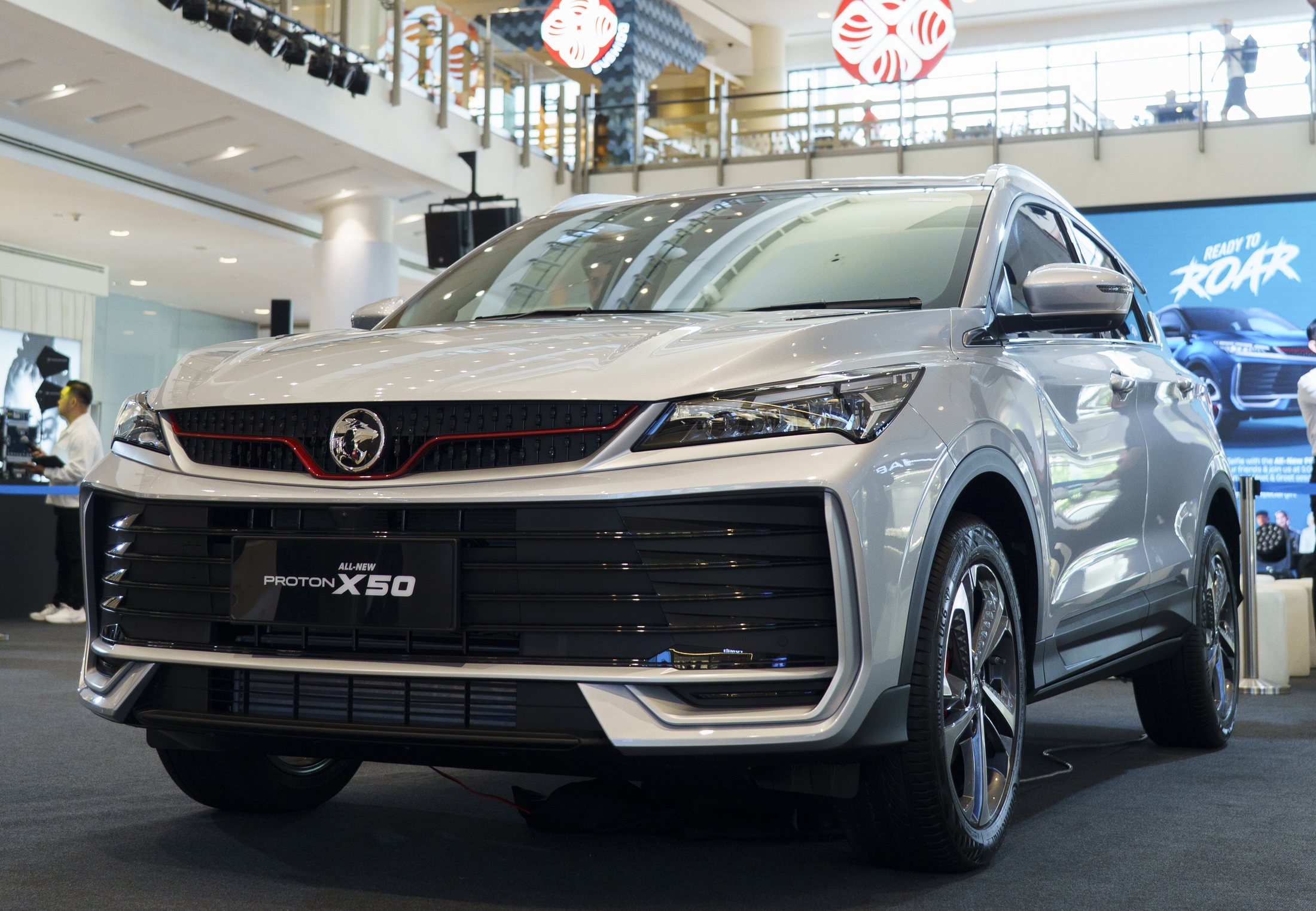 Silver Proton X50 in an official promotional display